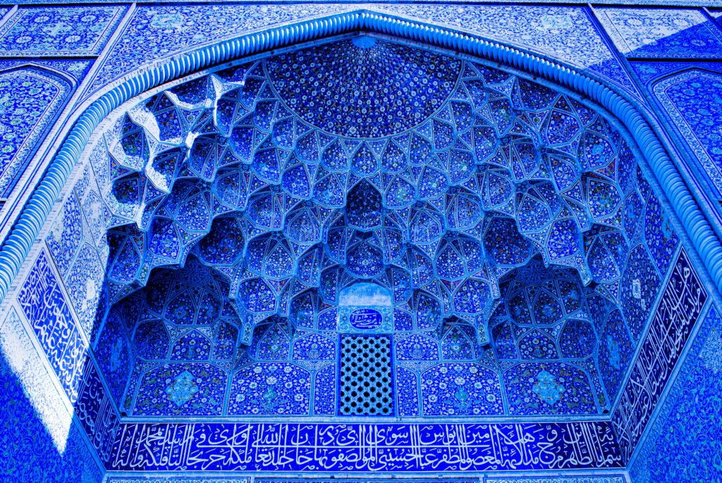 Explore the stunning Persian tilework and architecture of Isfahan's historic mosque.